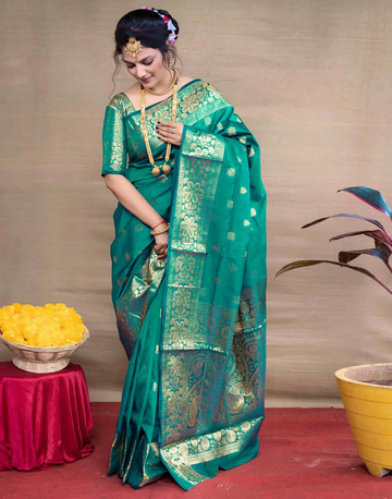 Exquisite Teal Green Banarasi Silk Saree with Opulent Golden Zari Weaving
