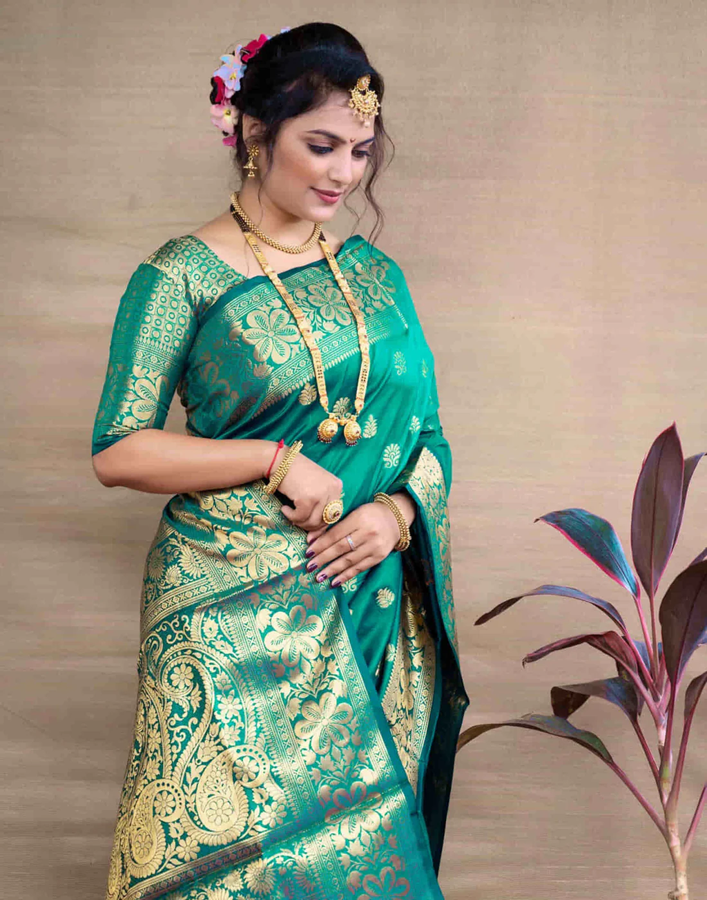 Exquisite Teal Green Banarasi Silk Saree with Opulent Golden Zari Weaving