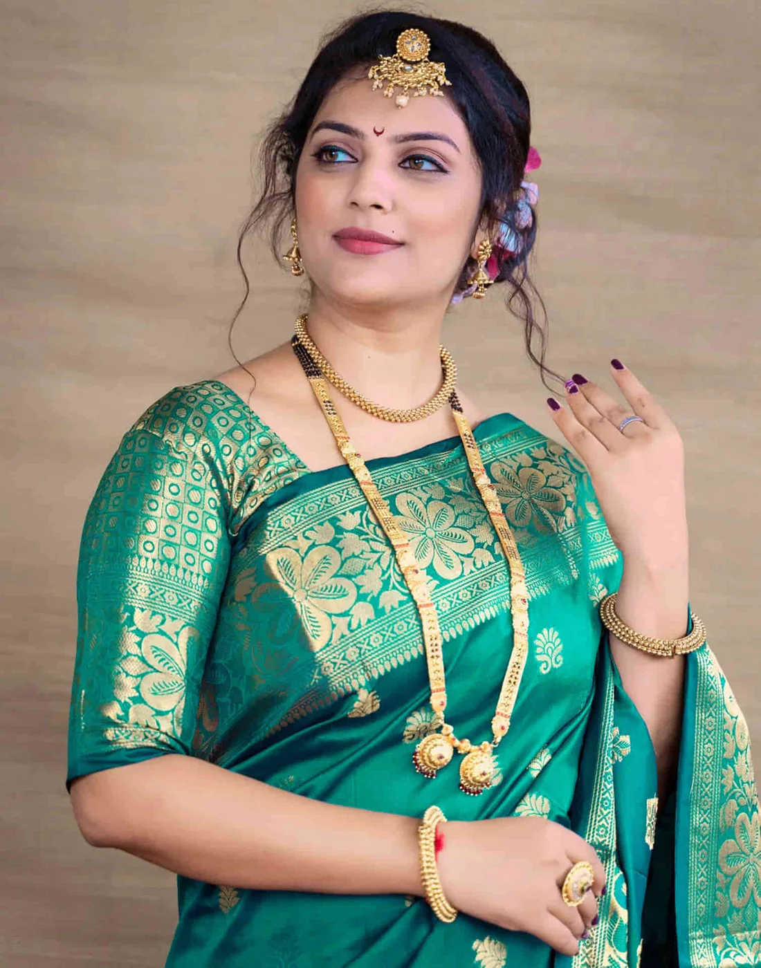 Exquisite Teal Green Banarasi Silk Saree with Opulent Golden Zari Weaving