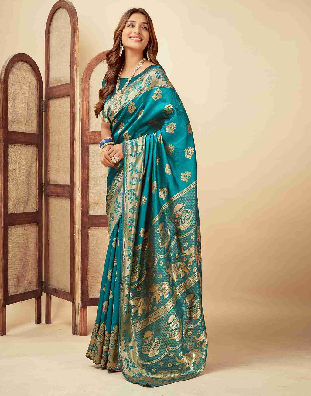 Elegant Teal Banarasi Silk Saree with Golden Zari Motifs