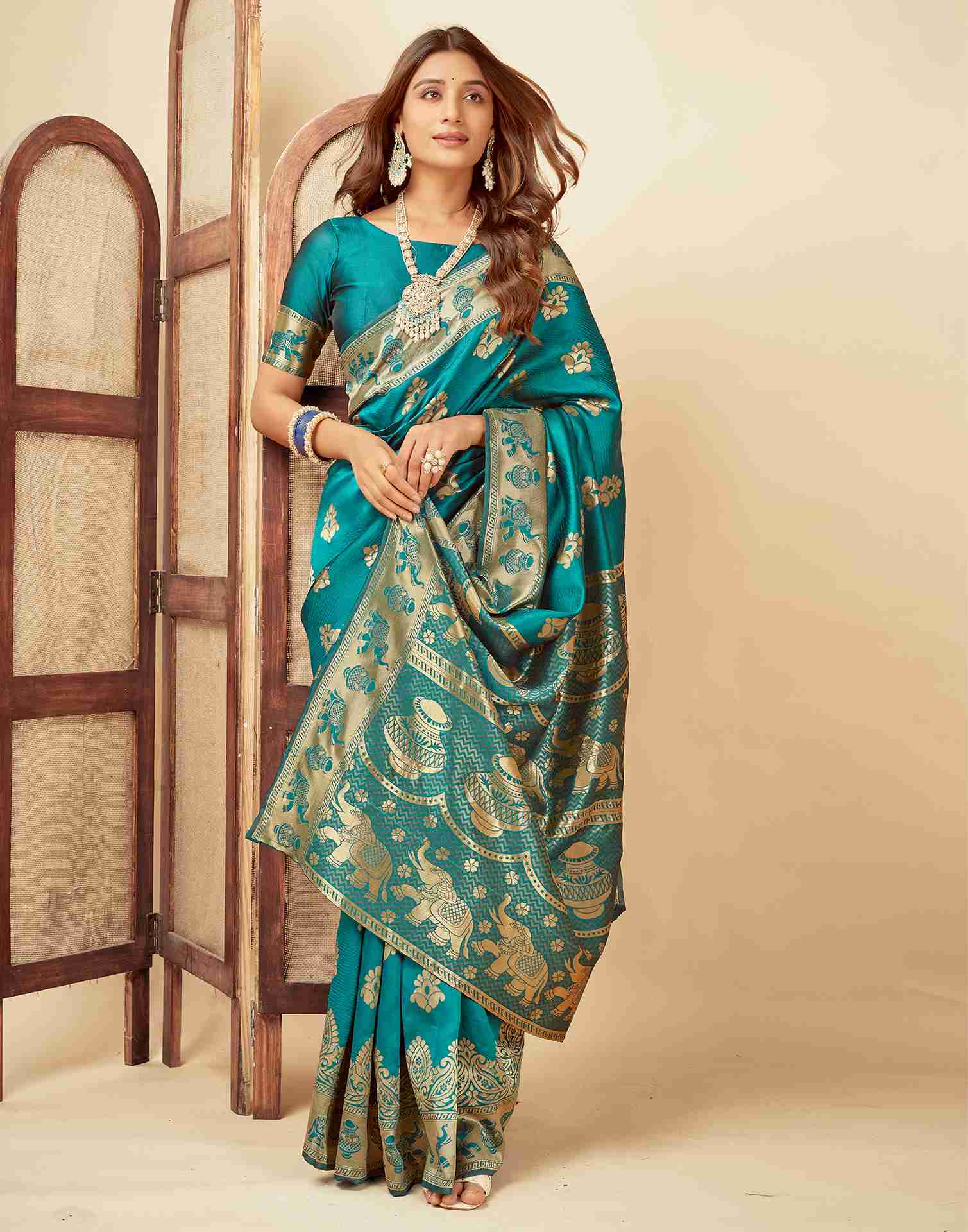 Elegant Teal Banarasi Silk Saree with Golden Zari Motifs