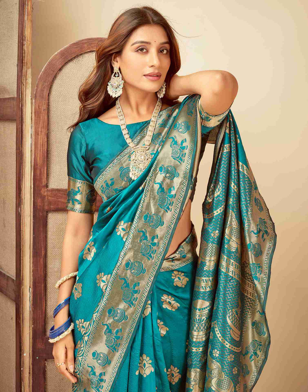 Elegant Teal Banarasi Silk Saree with Golden Zari Motifs