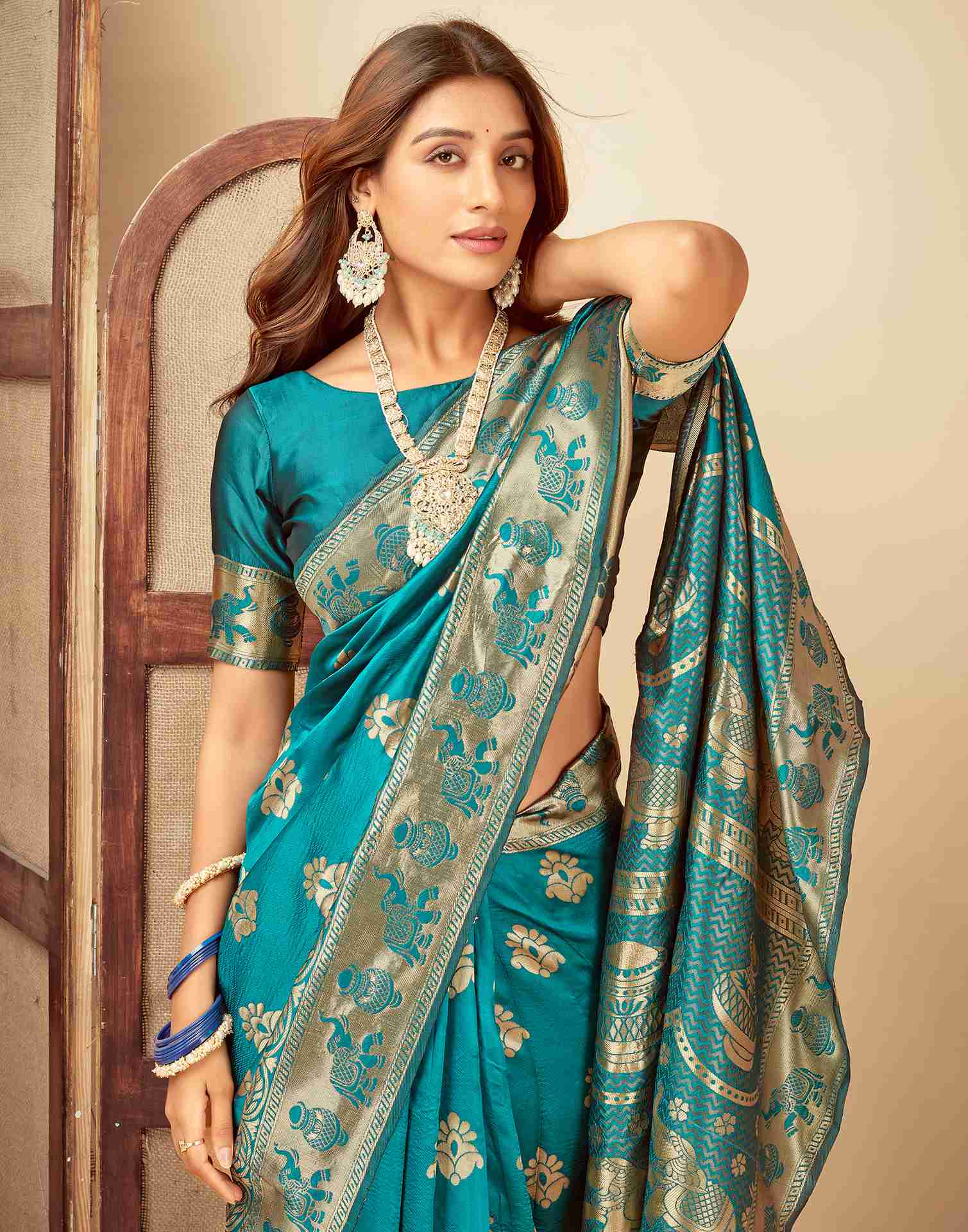 Elegant Teal Banarasi Silk Saree with Golden Zari Motifs